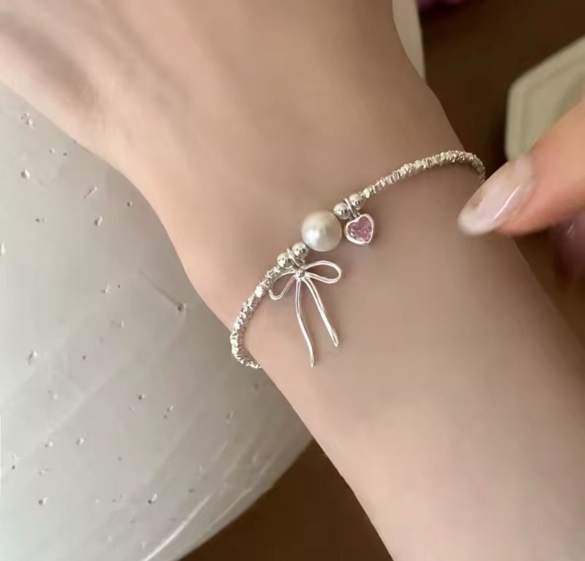 Pulsera corazon moño
