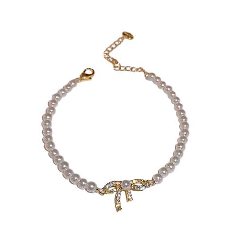 Pulsera perlas con moño circonia