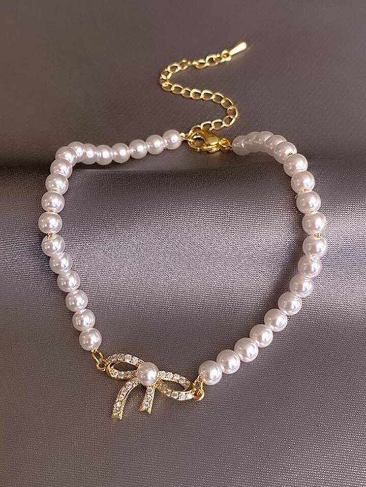 Pulsera perlas con moño circonia
