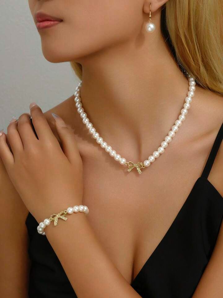 Pulsera perlas con moño circonia
