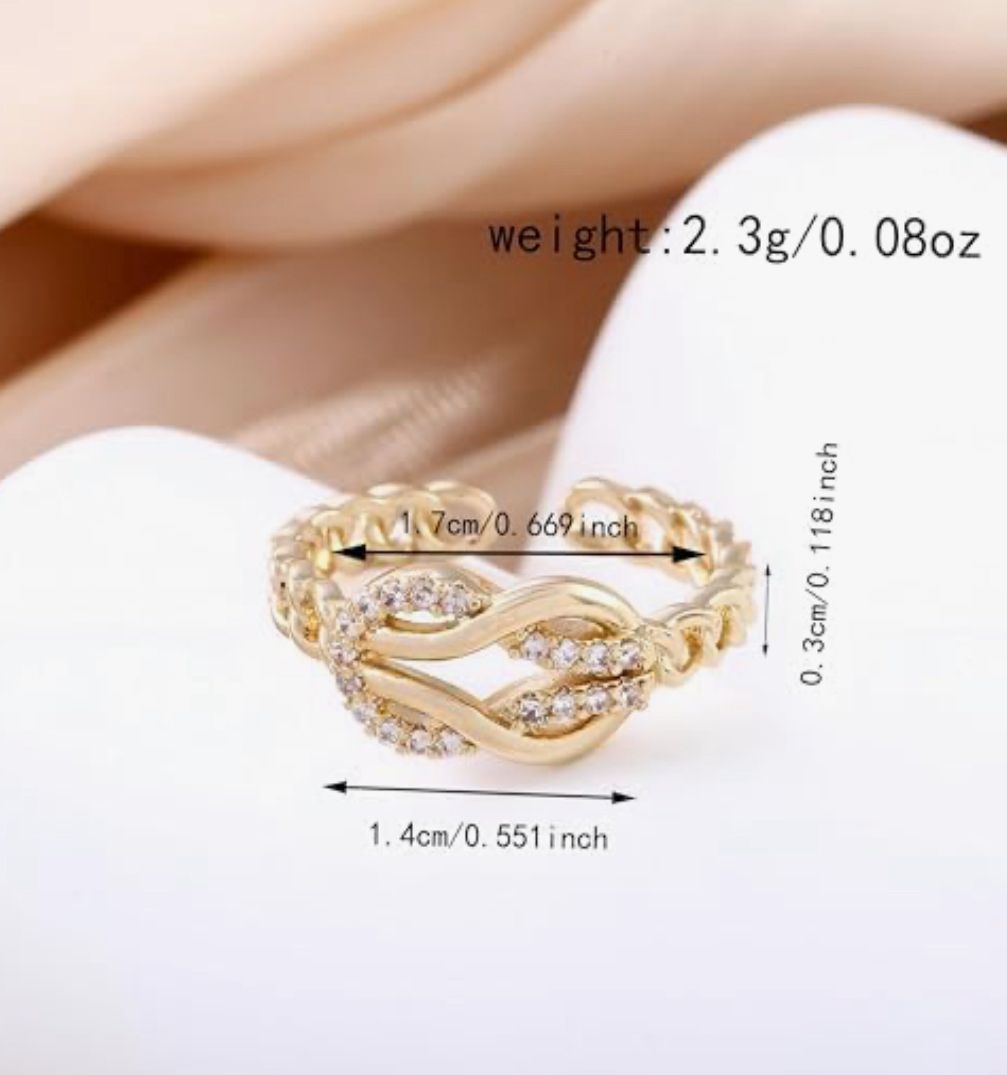 Anillo dorado  lazo zirconia