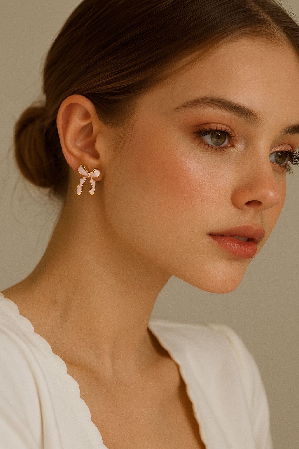 Aretes moño nacarado rosa suave